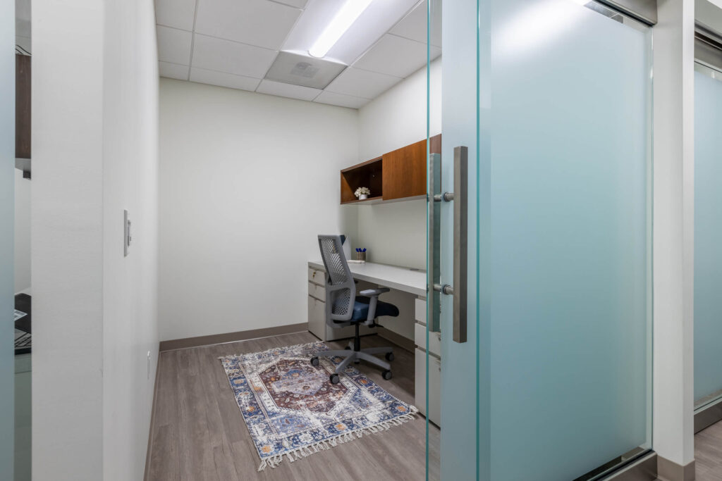 MetroOffices Fairfax 34 - Metro Offices Glass doors, desk, office space for rent.