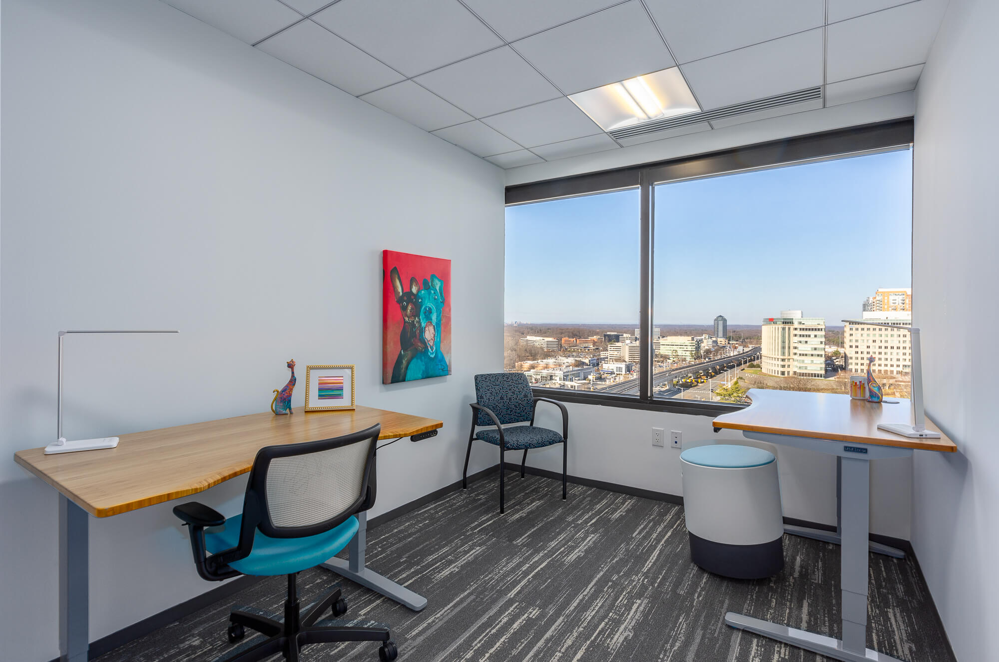 MetroOffices Tysons 27 - Metro Offices Office space for rent with a large city-view window.