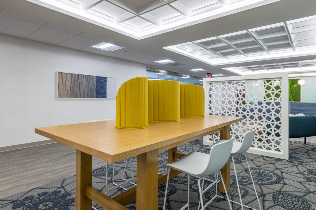 MetroOffices Fairfax 11 - Metro Offices A coworking space furnished with a yellow table and chairs.
