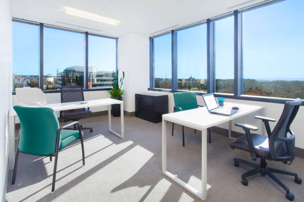 Double Office Edit - Metro Offices Office space with a desk and chairs offering a city view is available for rent.