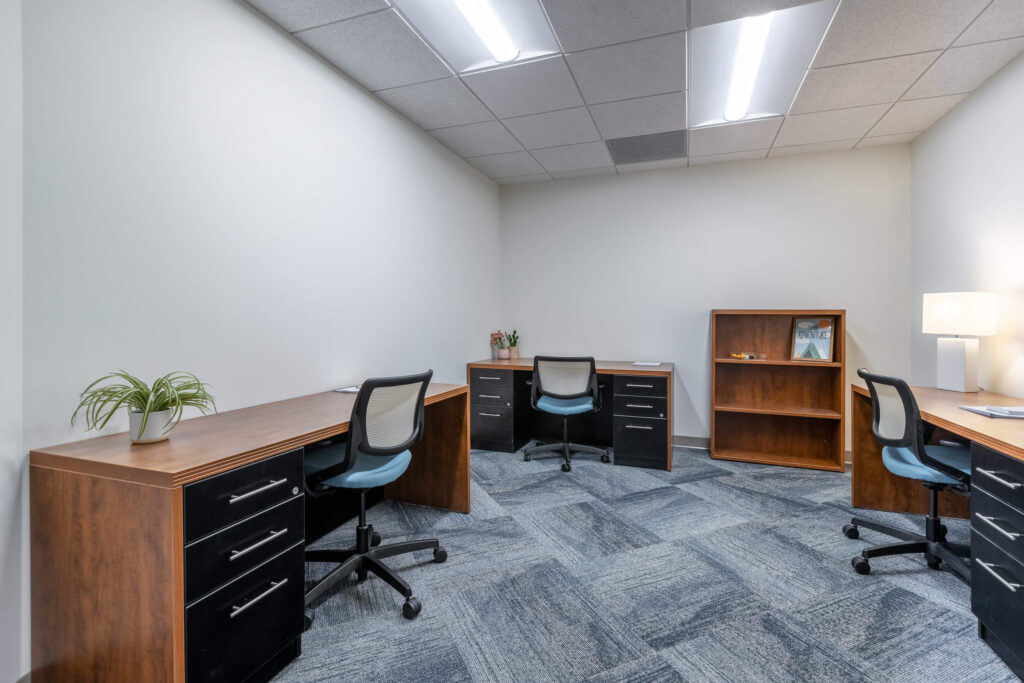 MetroOffices Fairfax 39 - Metro Offices Office space for rent with two desks and a chair.