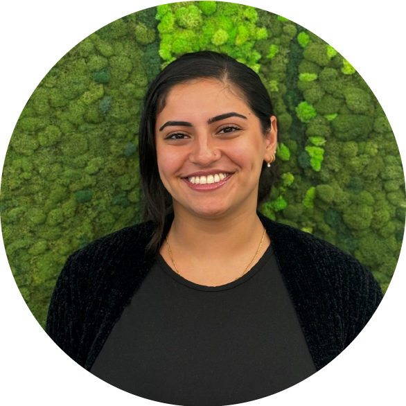 Nava 01 2 - Metro Offices A cheerful individual with dark hair beams against a vibrant, textured green backdrop, creating a captivating and joyful scene.