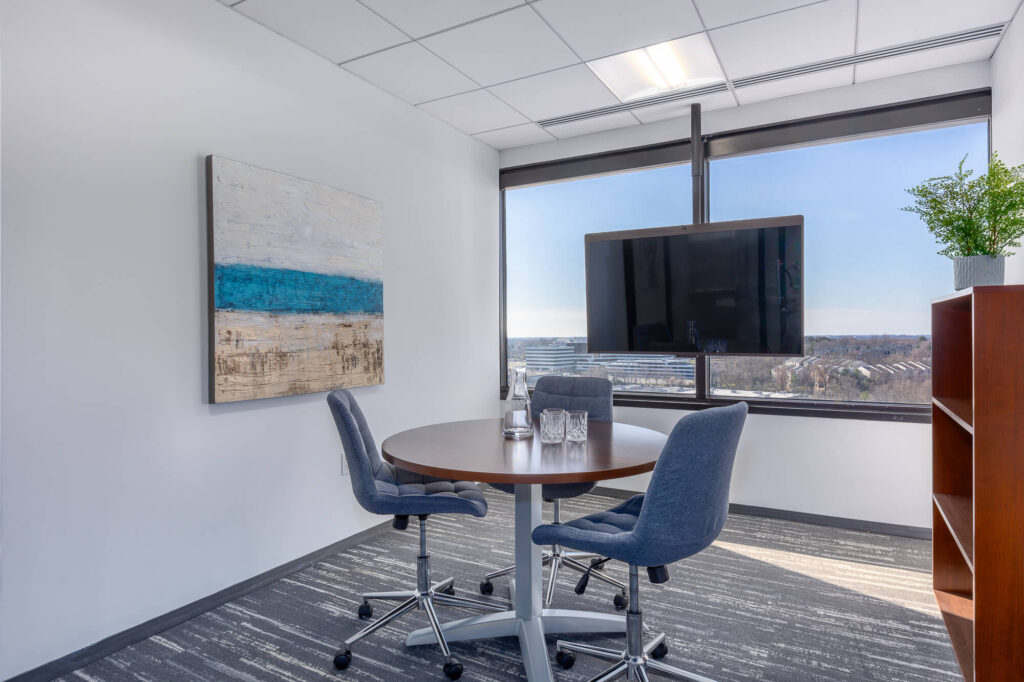 A meeting room with a view of the city.